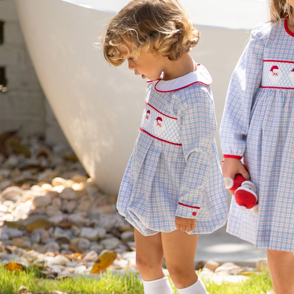 Two children in blue and gray smocked outfits